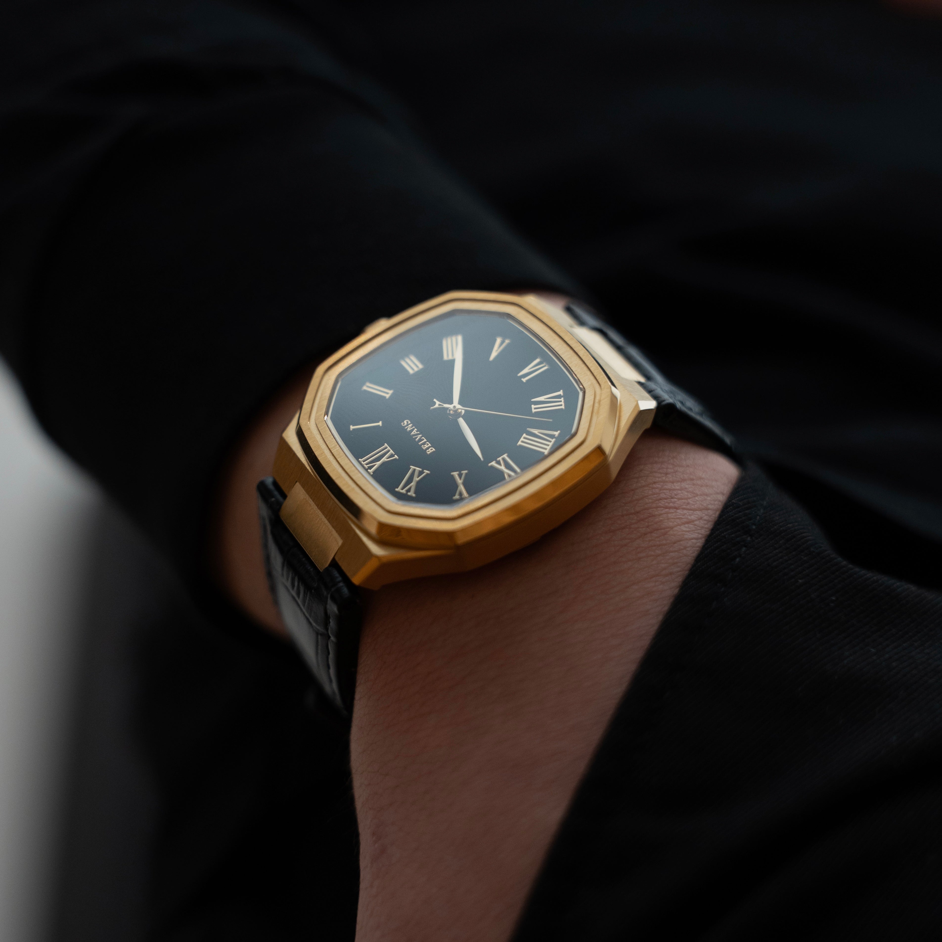 Belvans Heritage automatic gold watch on wrist, luxury titanium case