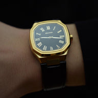 close video shot of the belvans heritage gold watch